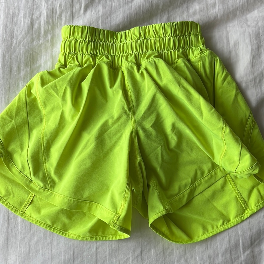 Women’s Neon yellow high rise lululemon track that shorts 4inch size 2
